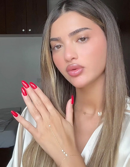 Rama Fakhro wearing her 18K Gold Array of Light Hand Chain